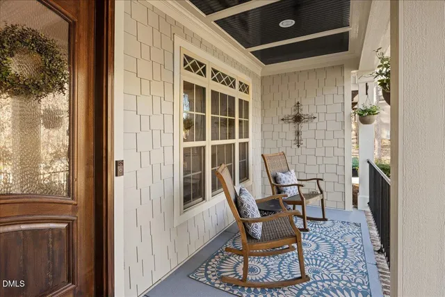 a view of a dining room with furniture kitchen and wooden floor