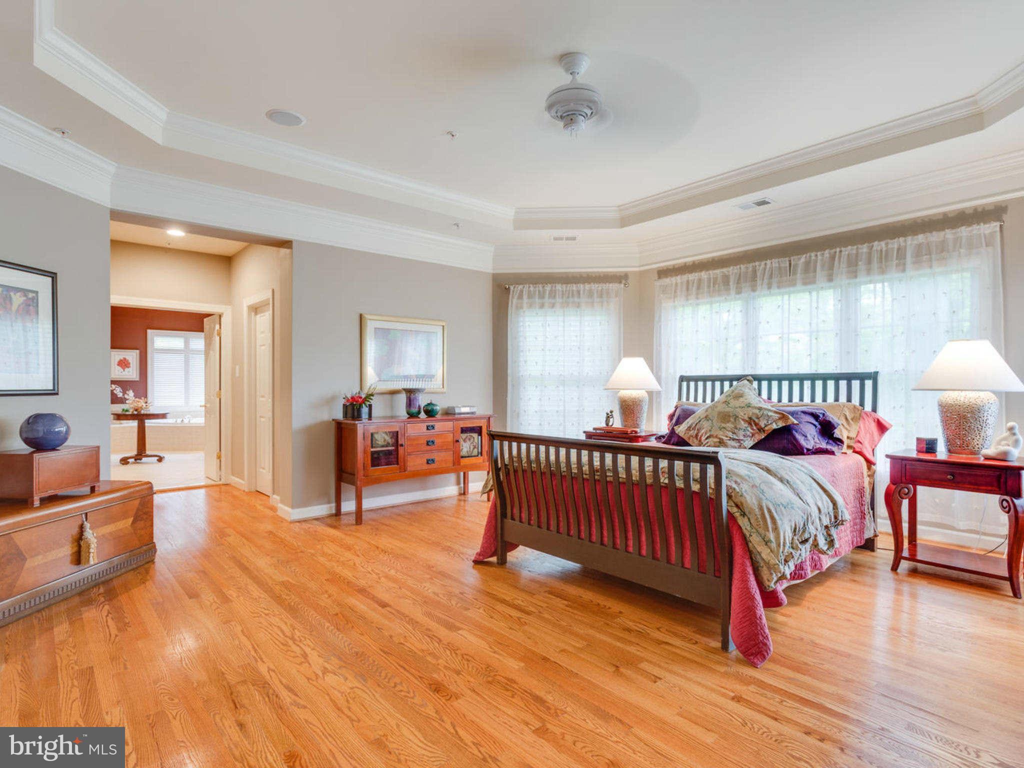 9208 Jones Mill Road Chevy Chase, MD 20815 - Photo 15 of 30 a bedroom with furniture and a wooden floor