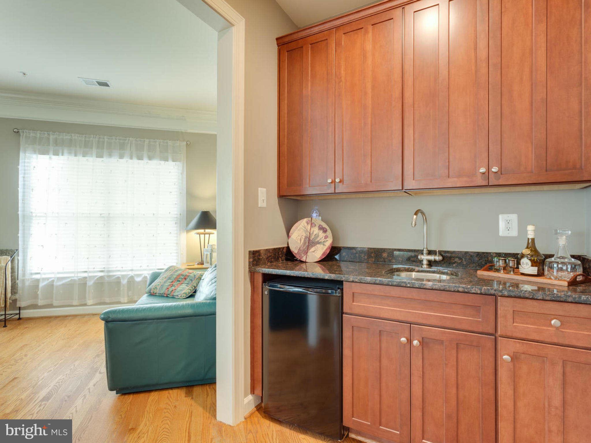 9208 Jones Mill Road Chevy Chase, MD 20815 - Photo 16 of 30 a kitchen with a sink and cabinets