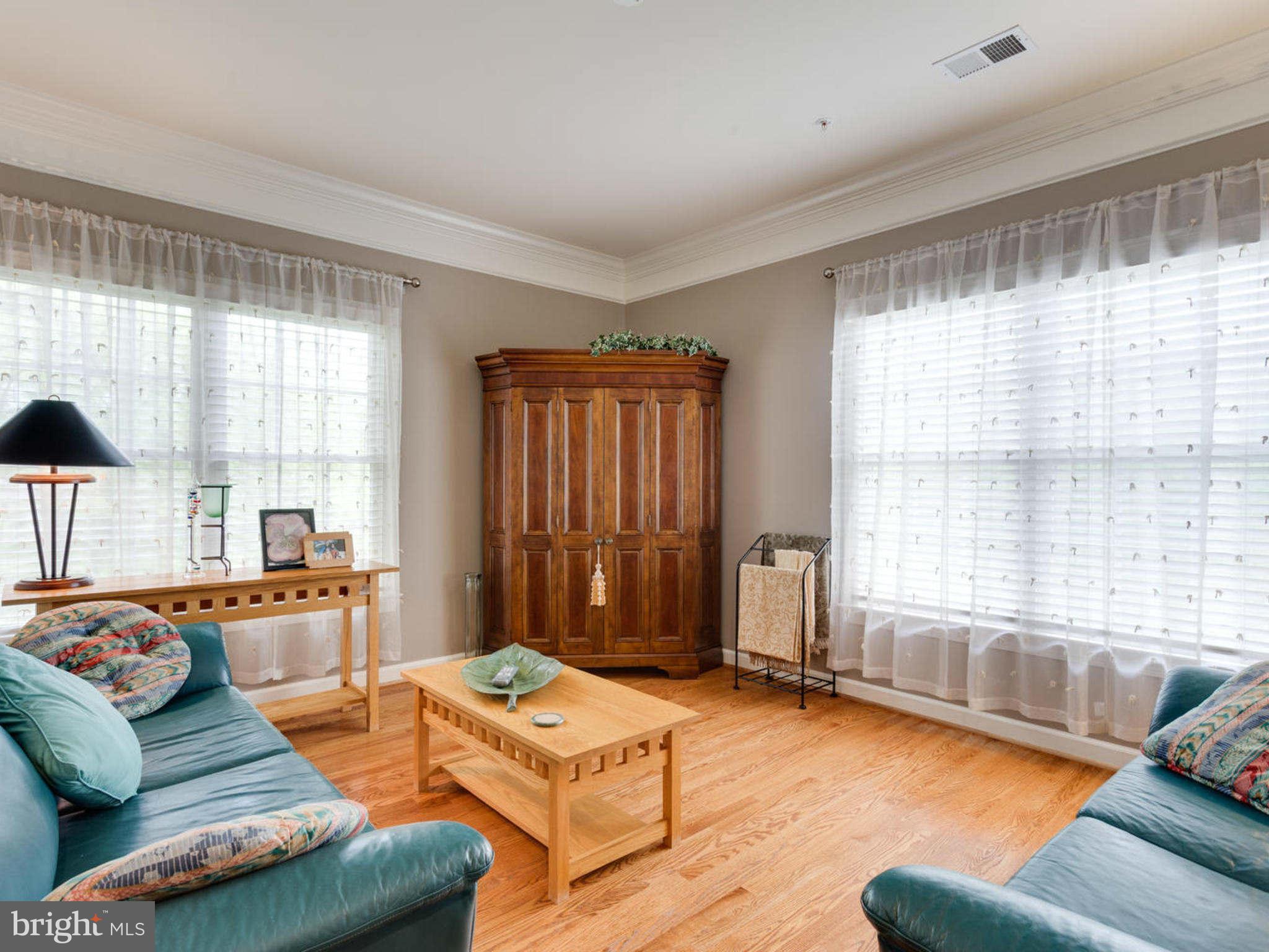 9208 Jones Mill Road Chevy Chase, MD 20815 - Photo 17 of 30 a living room with furniture and a large window
