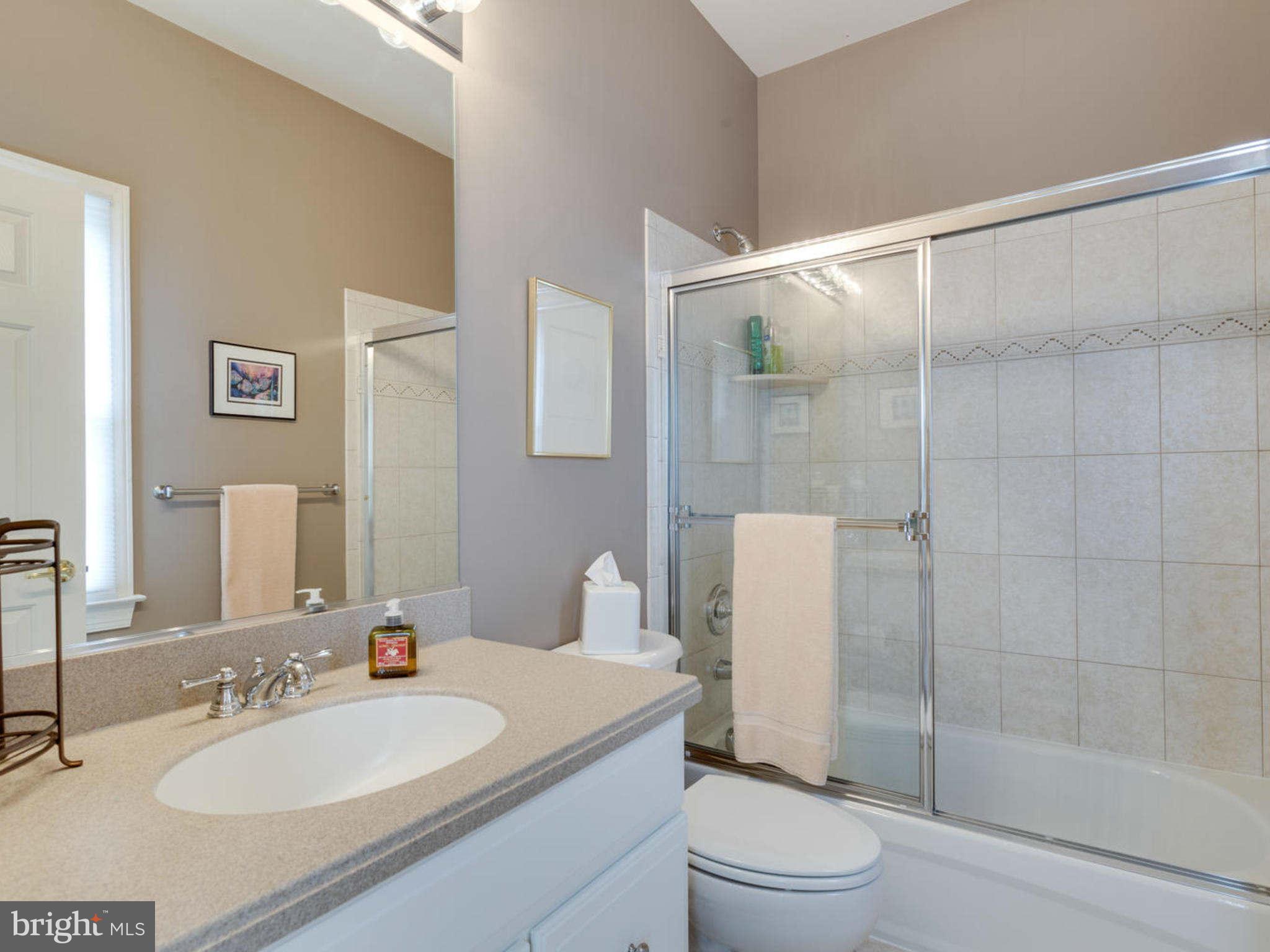 9208 Jones Mill Road Chevy Chase, MD 20815 - Photo 20 of 30 a bathroom with a sink a toilet and shower
