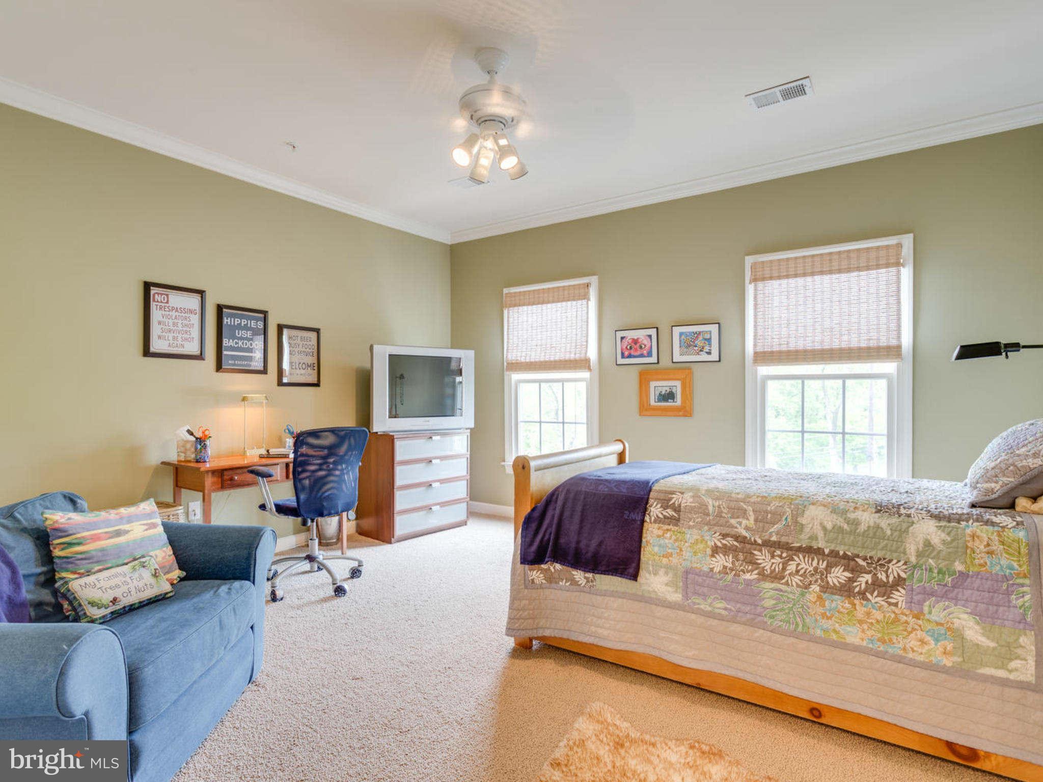 9208 Jones Mill Road Chevy Chase, MD 20815 - Photo 21 of 30 a bedroom with furniture and a large window