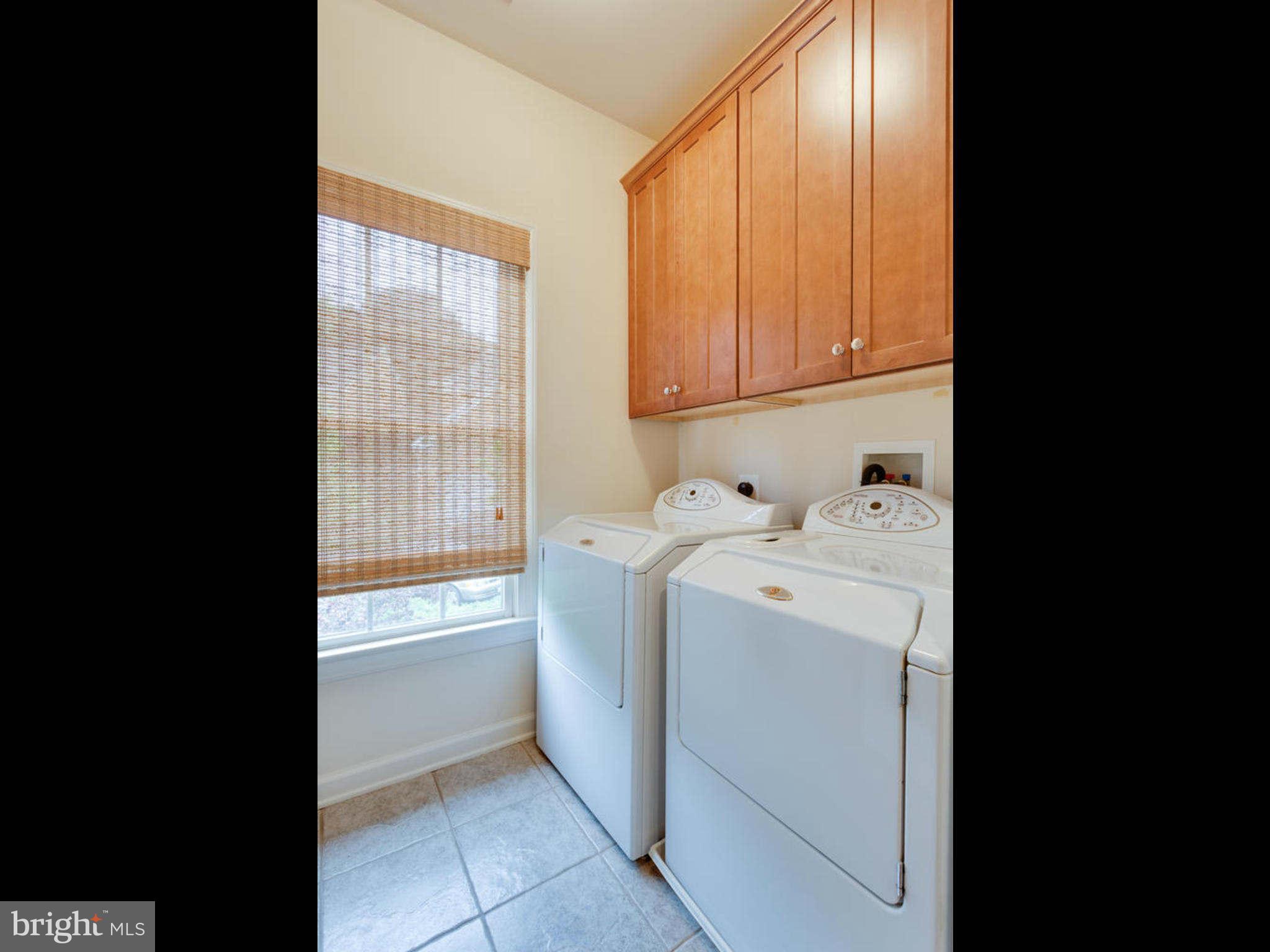 9208 Jones Mill Road Chevy Chase, MD 20815 - Photo 24 of 30 a utility room with dryer and washer
