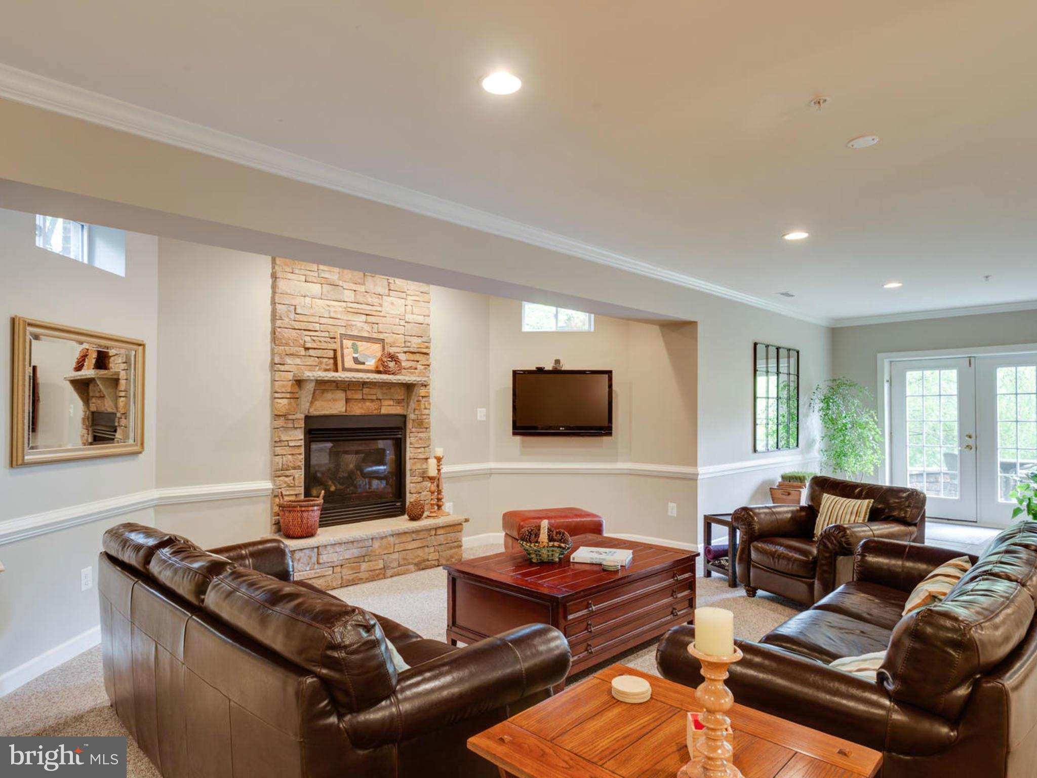 9208 Jones Mill Road Chevy Chase, MD 20815 - Photo 25 of 30 a living room with furniture and a flat screen tv