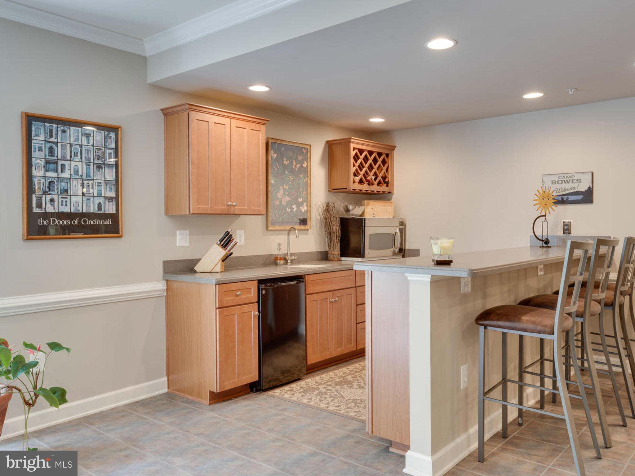 9208 Jones Mill Road Chevy Chase, MD 20815 - Photo 26 of 30 a kitchen with a sink cabinets and window