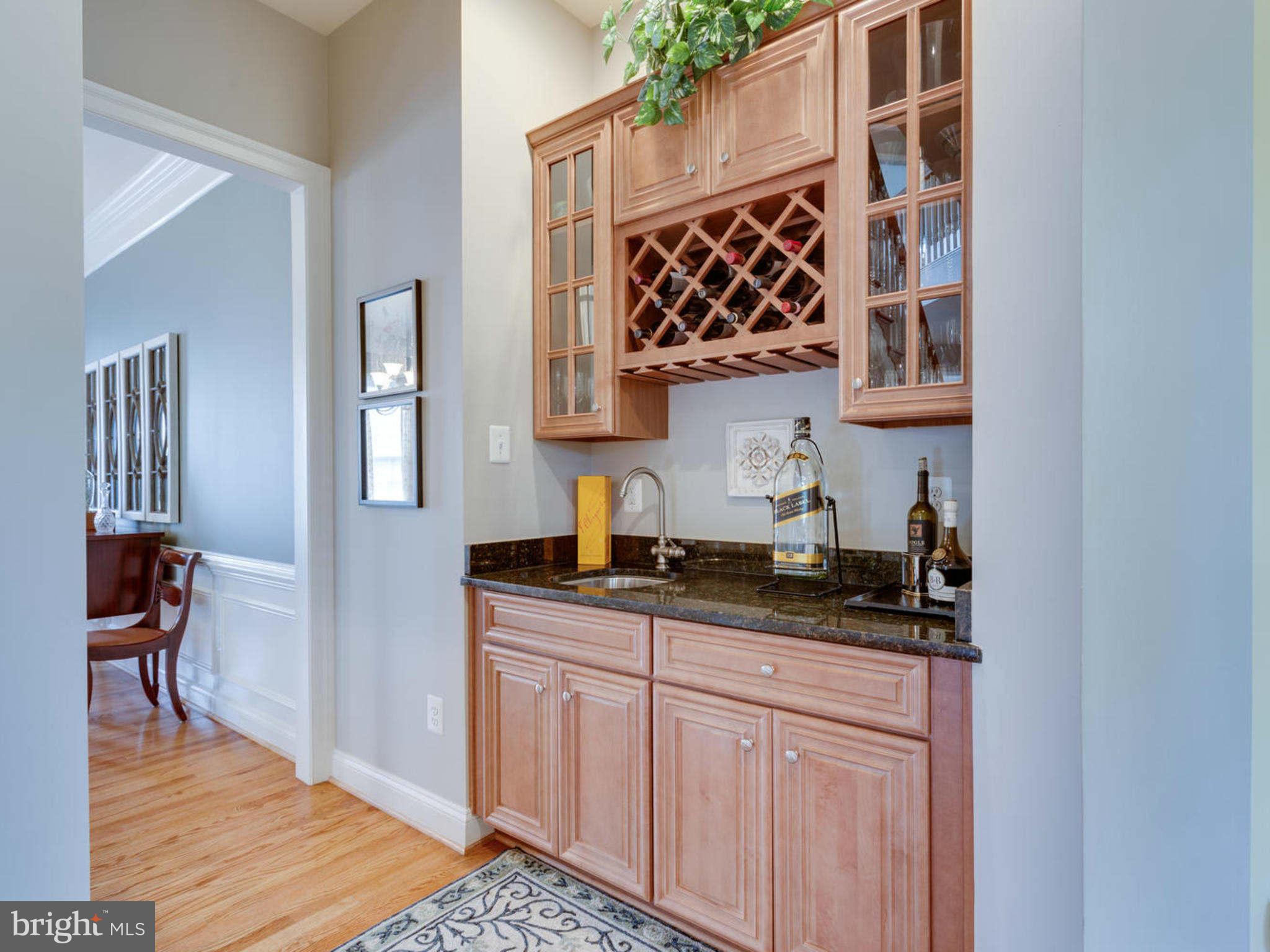 9208 Jones Mill Road Chevy Chase, MD 20815 - Photo 5 of 30 a kitchen with granite countertop a sink and cabinets