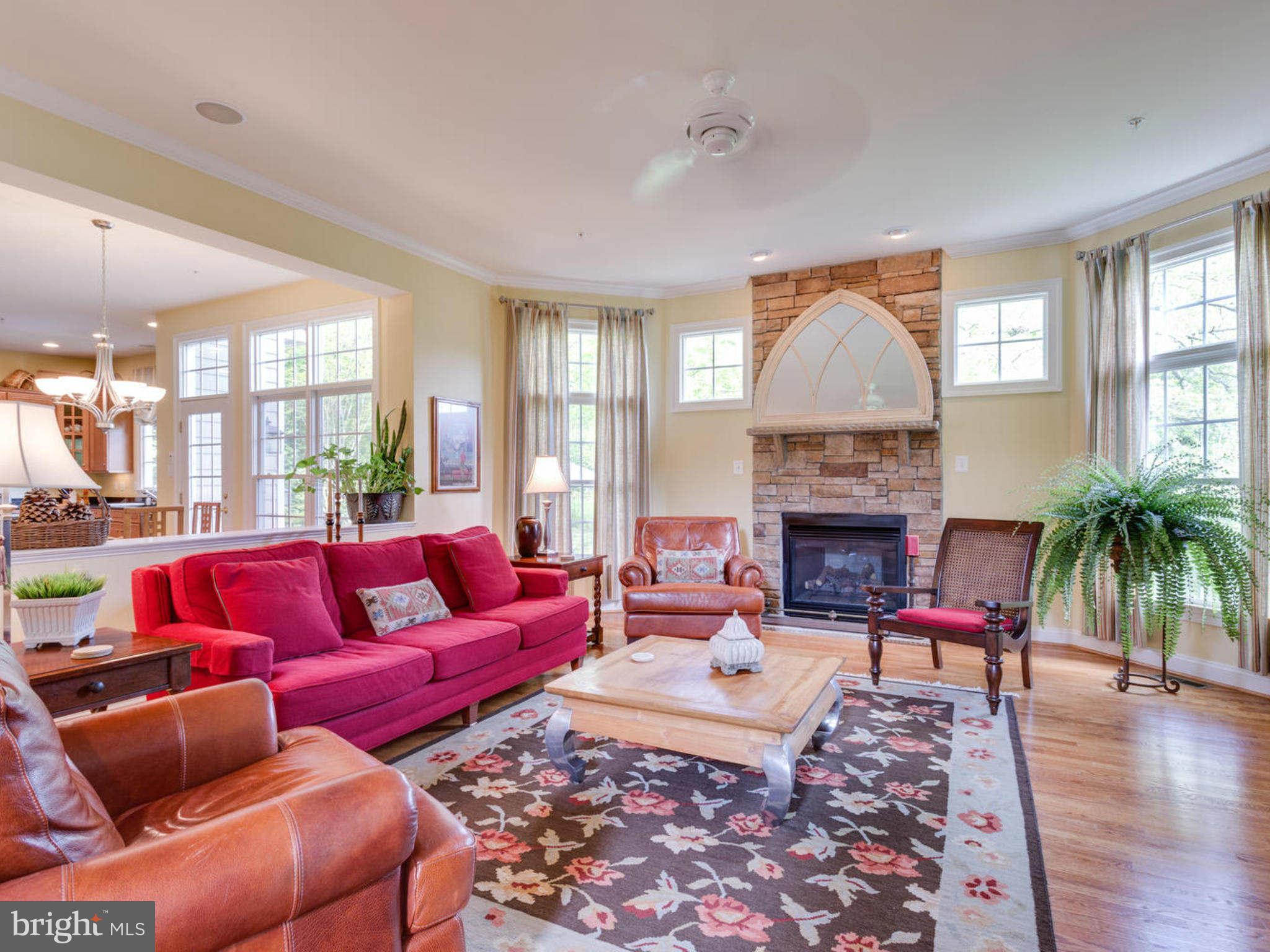 9208 Jones Mill Road Chevy Chase, MD 20815 - Photo 8 of 30 a living room with furniture fireplace and a large window