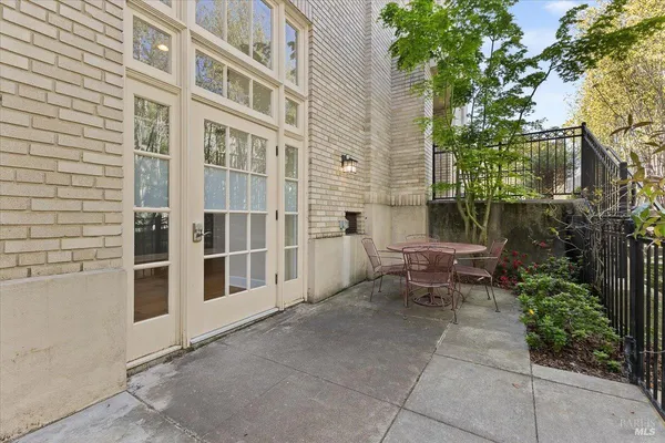 a view of a building with outdoor seating