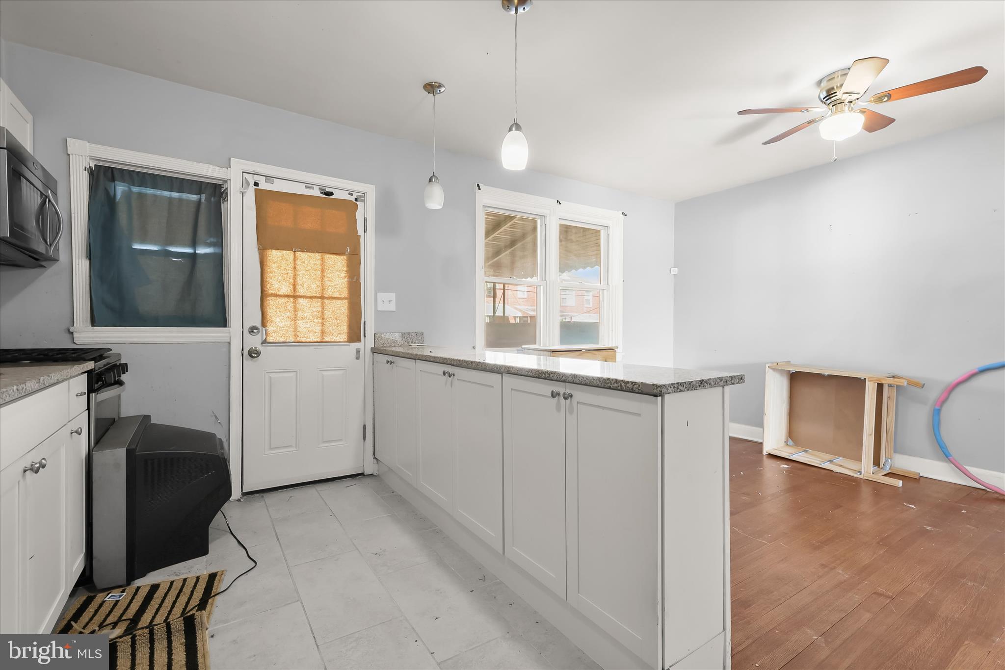 1504 North Linwood Avenue Baltimore, MD 21213 - Photo 11 of 29 a view of a kitchen with furniture and windows