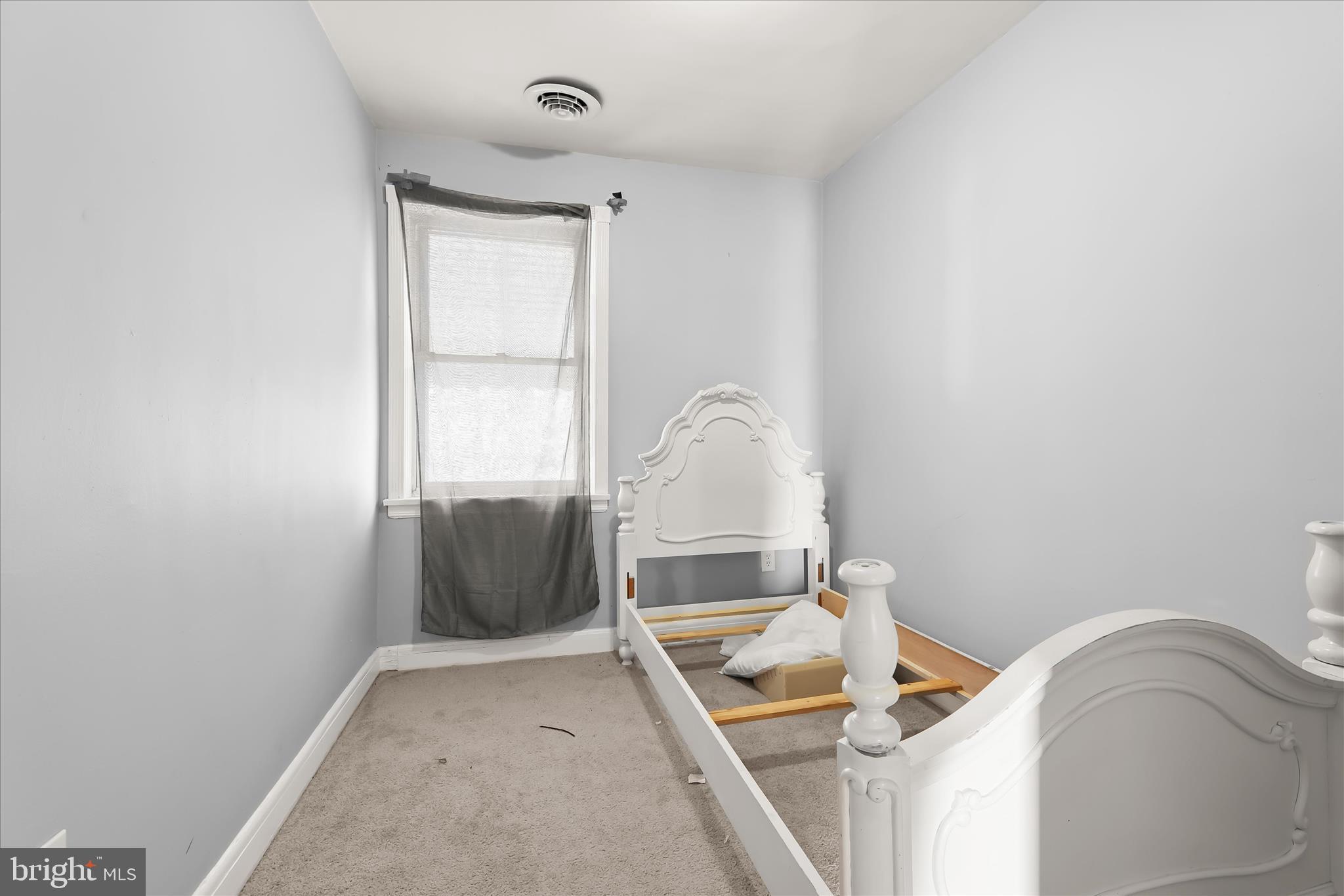 1504 North Linwood Avenue Baltimore, MD 21213 - Photo 18 of 29 a room with a couch