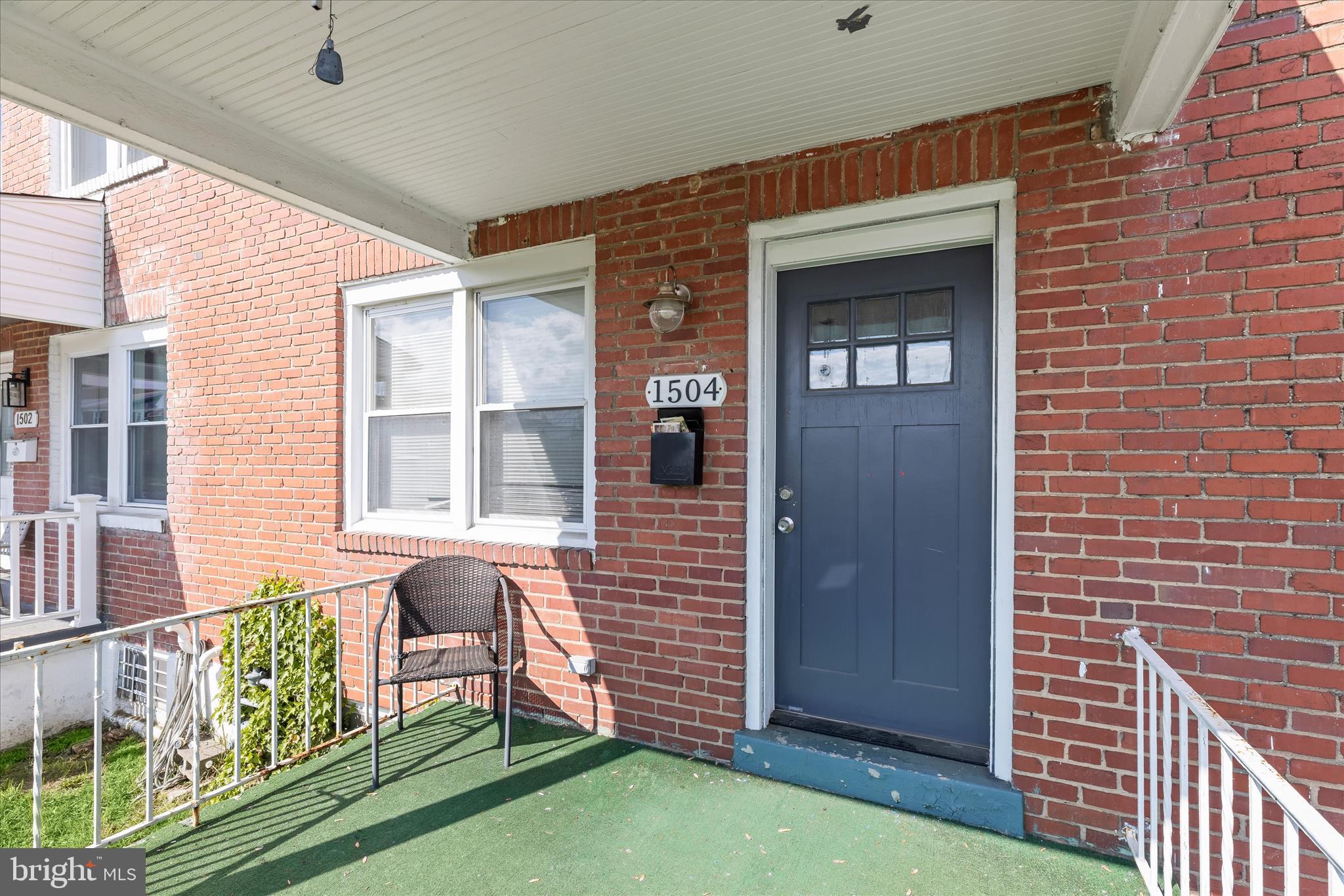 1504 North Linwood Avenue Baltimore, MD 21213 - Photo 2 of 29 a front view of a house with garden