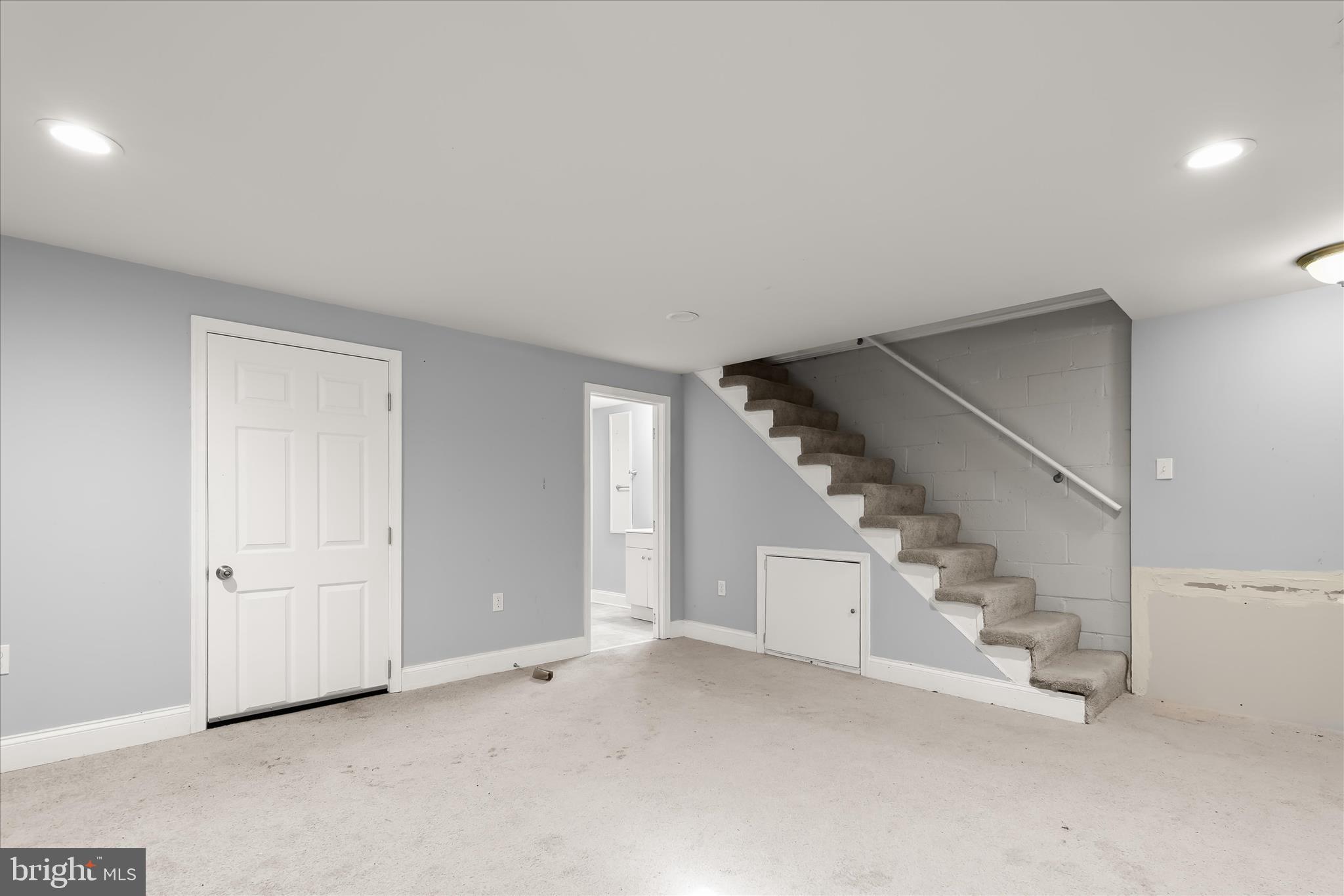 1504 North Linwood Avenue Baltimore, MD 21213 - Photo 23 of 29 an empty room with stairs and white walls