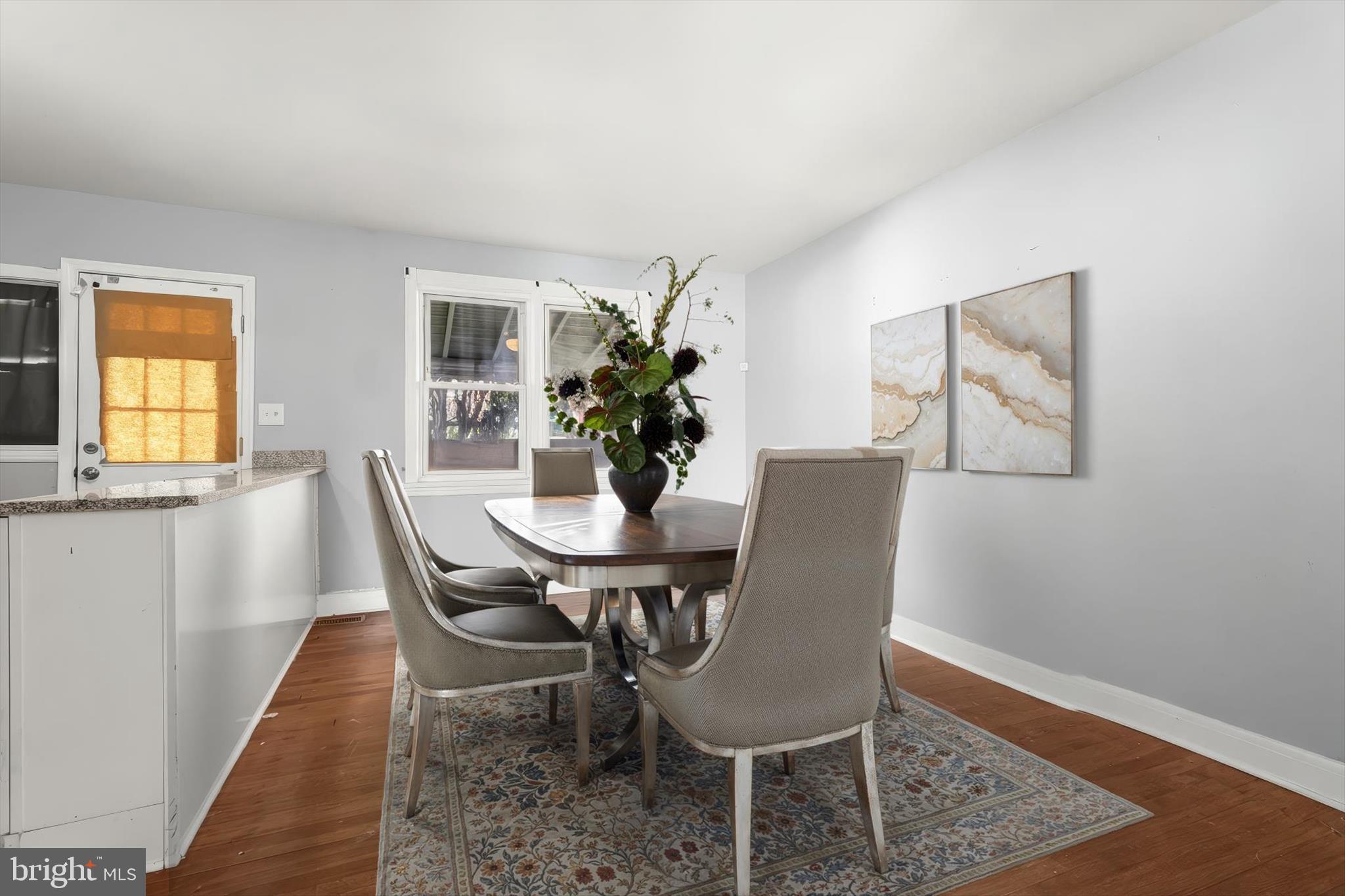 1504 North Linwood Avenue Baltimore, MD 21213 - Photo 7 of 29 a dining room with furniture and window