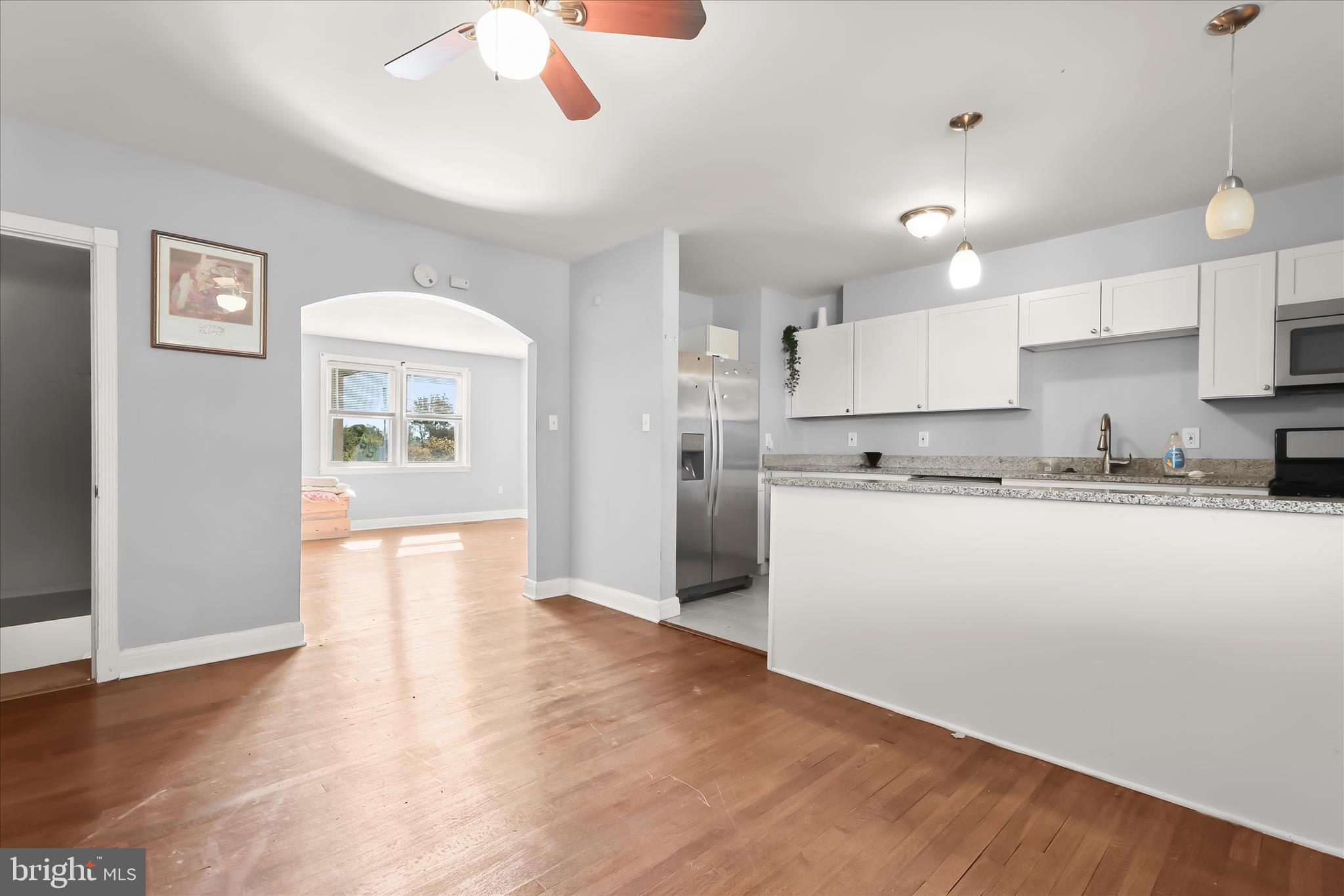 1504 North Linwood Avenue Baltimore, MD 21213 - Photo 9 of 29 a view of kitchen with wooden floor and window