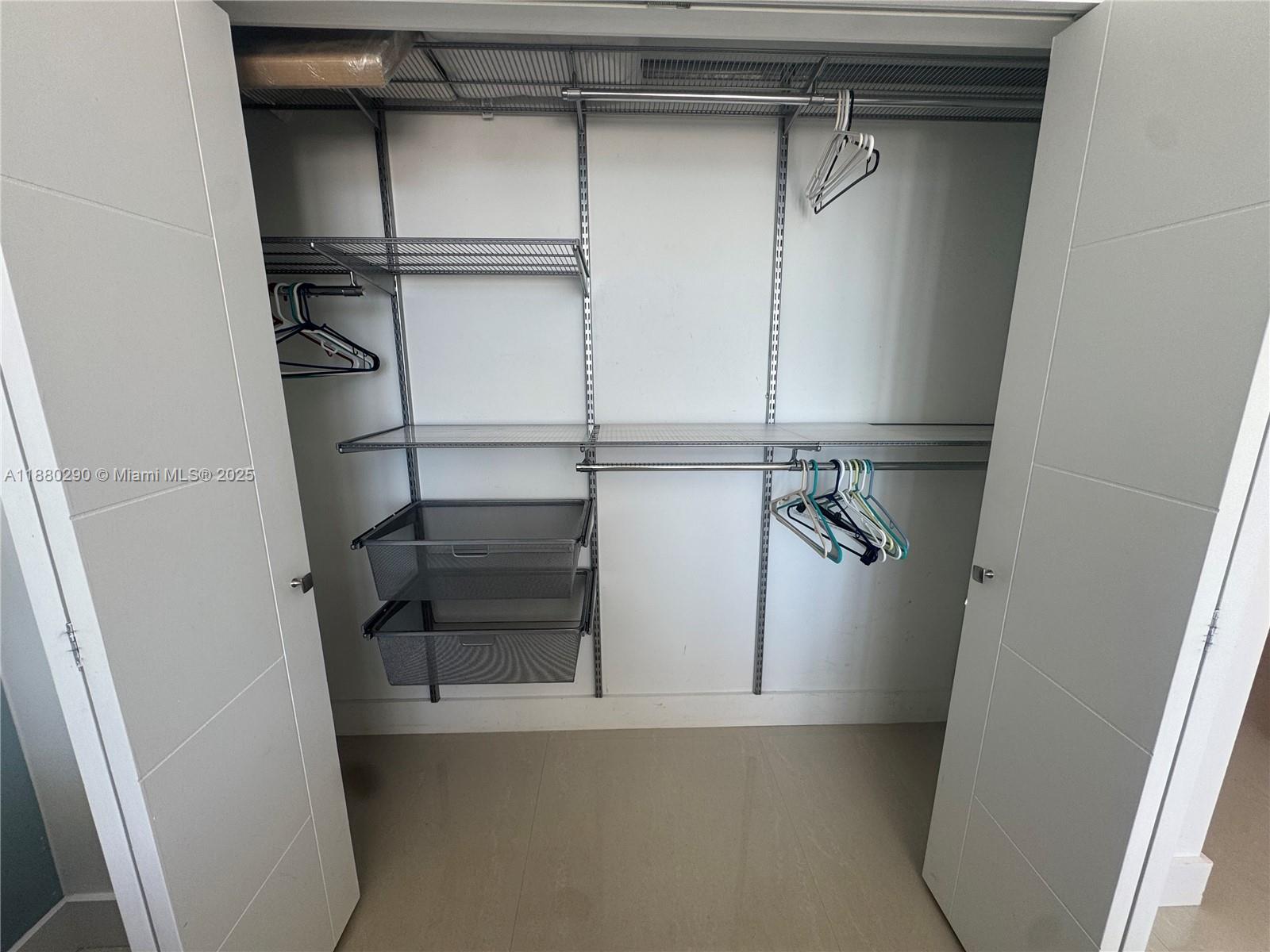 5161 Collins Avenue, Unit 514 Miami Beach, FL 33140 - Photo 14 of 34 a view of walk in closet with empty racks