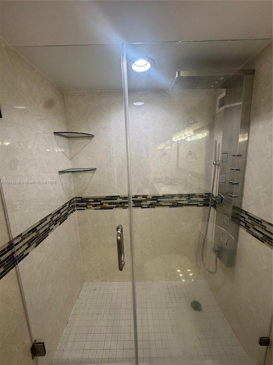 5161 Collins Avenue, Unit 514 Miami Beach, FL 33140 - Photo 21 of 34 a bathroom with a shower