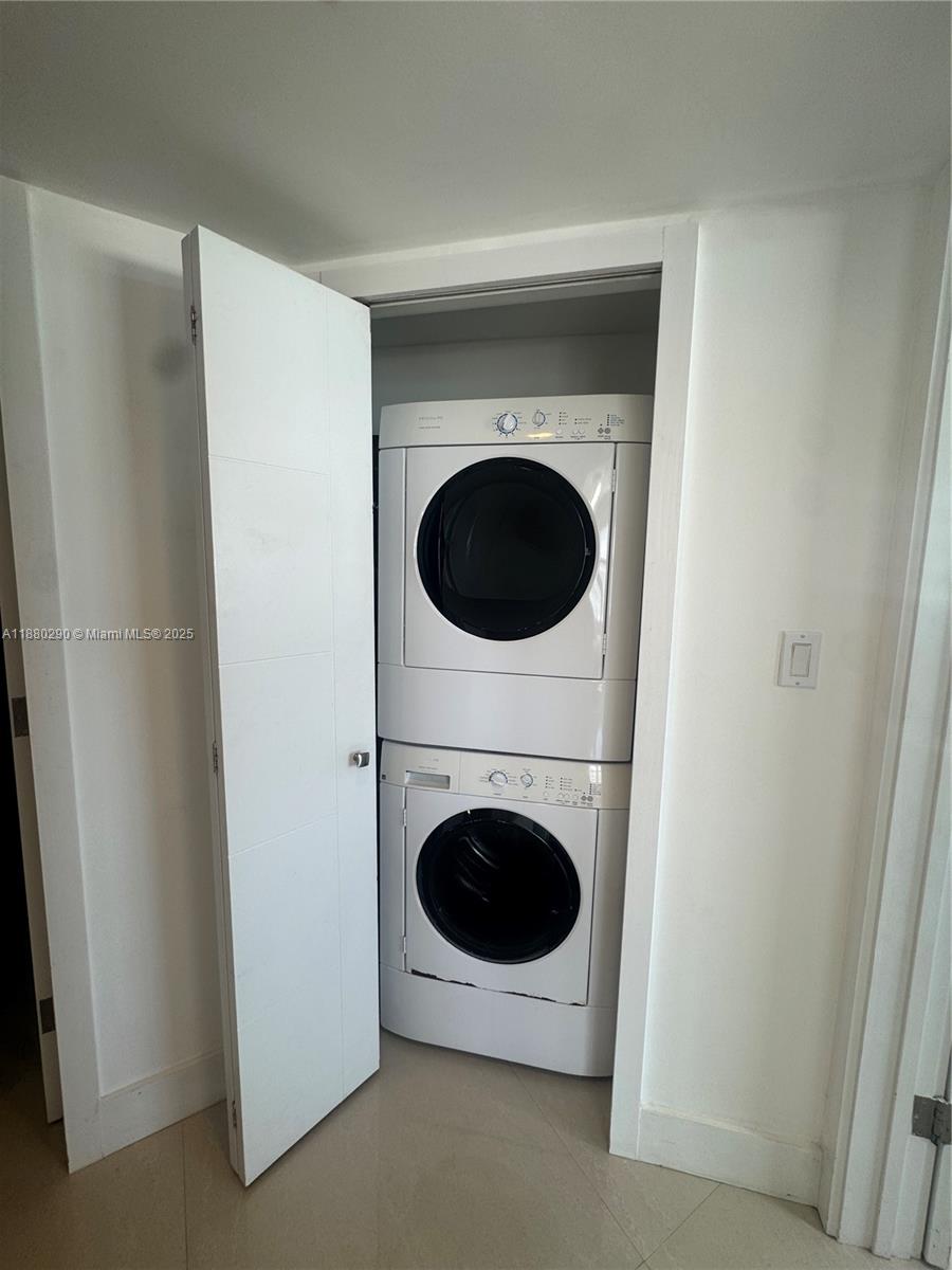 5161 Collins Avenue, Unit 514 Miami Beach, FL 33140 - Photo 22 of 34 a close up view of a washer and dryer