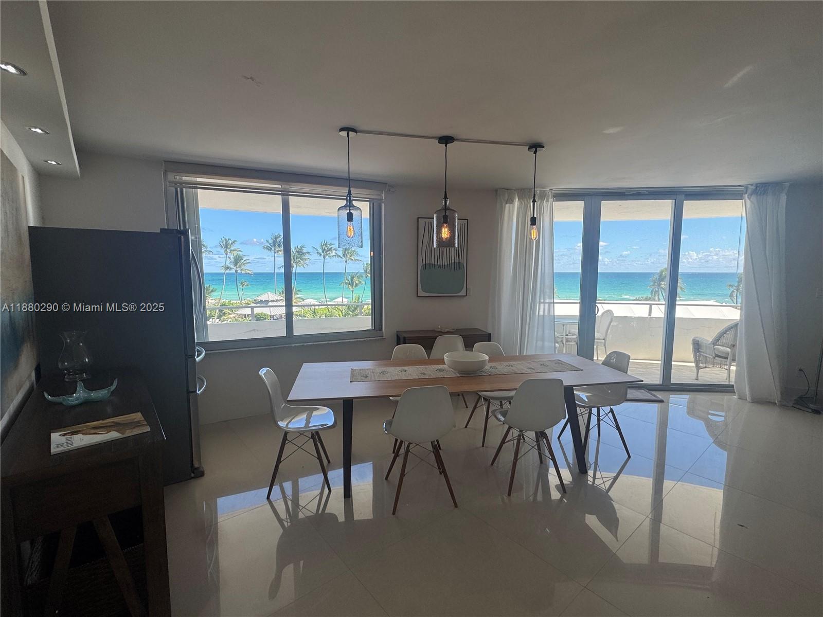5161 Collins Avenue, Unit 514 Miami Beach, FL 33140 - Photo 5 of 34 a view of a dining room with furniture window and outside view