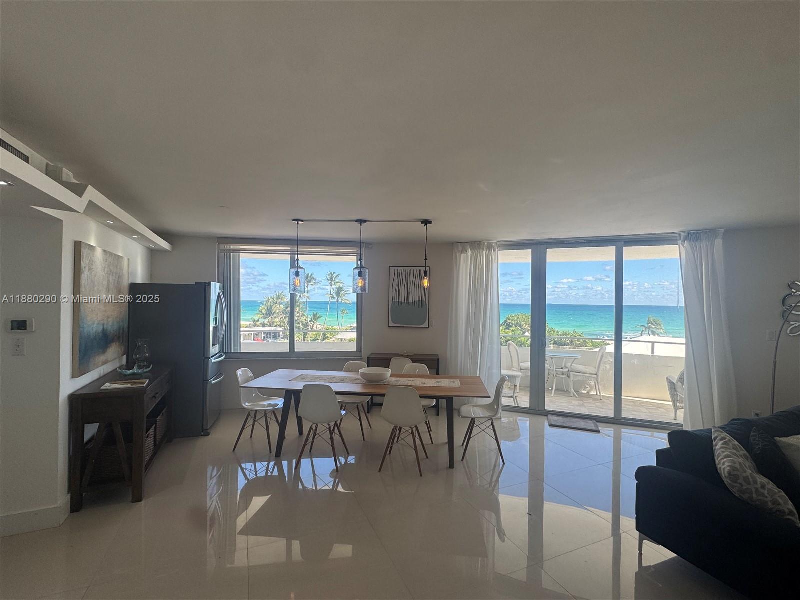 5161 Collins Avenue, Unit 514 Miami Beach, FL 33140 - Photo 6 of 34 a view of a livingroom with furniture window and outside view