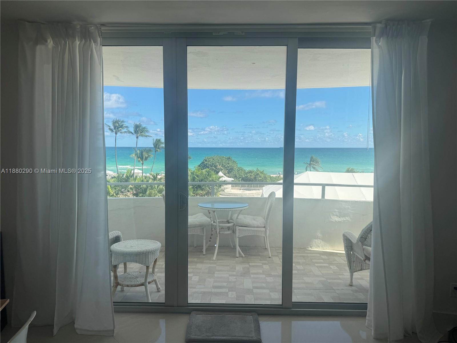 5161 Collins Avenue, Unit 514 Miami Beach, FL 33140 - Photo 7 of 34 a view of a glass door and an outdoor space
