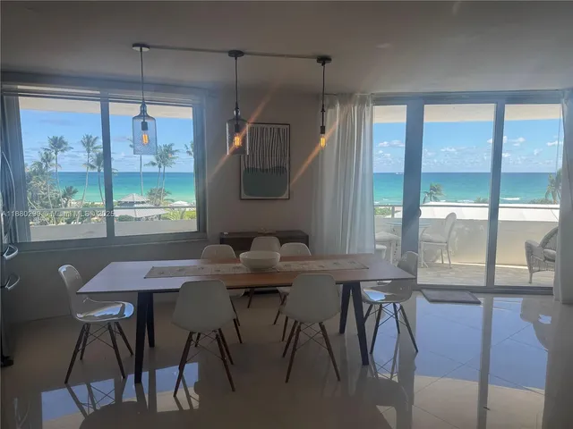 a bedroom with a bed and a television