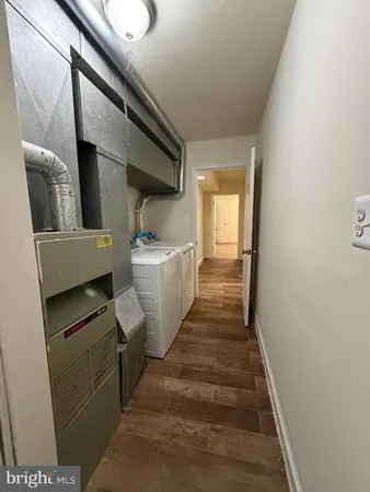 a hallway with washer and dryer