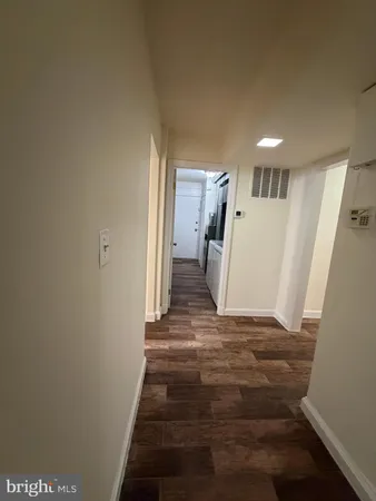 a view of a hallway with stairs