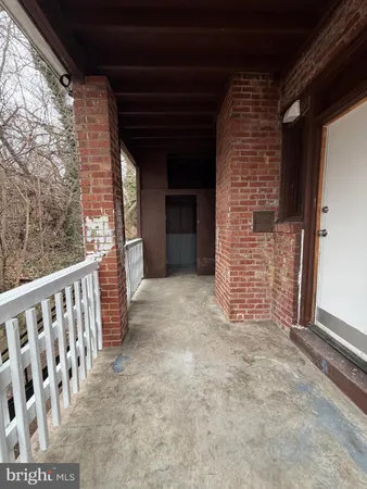 a view of wooden door and stairs