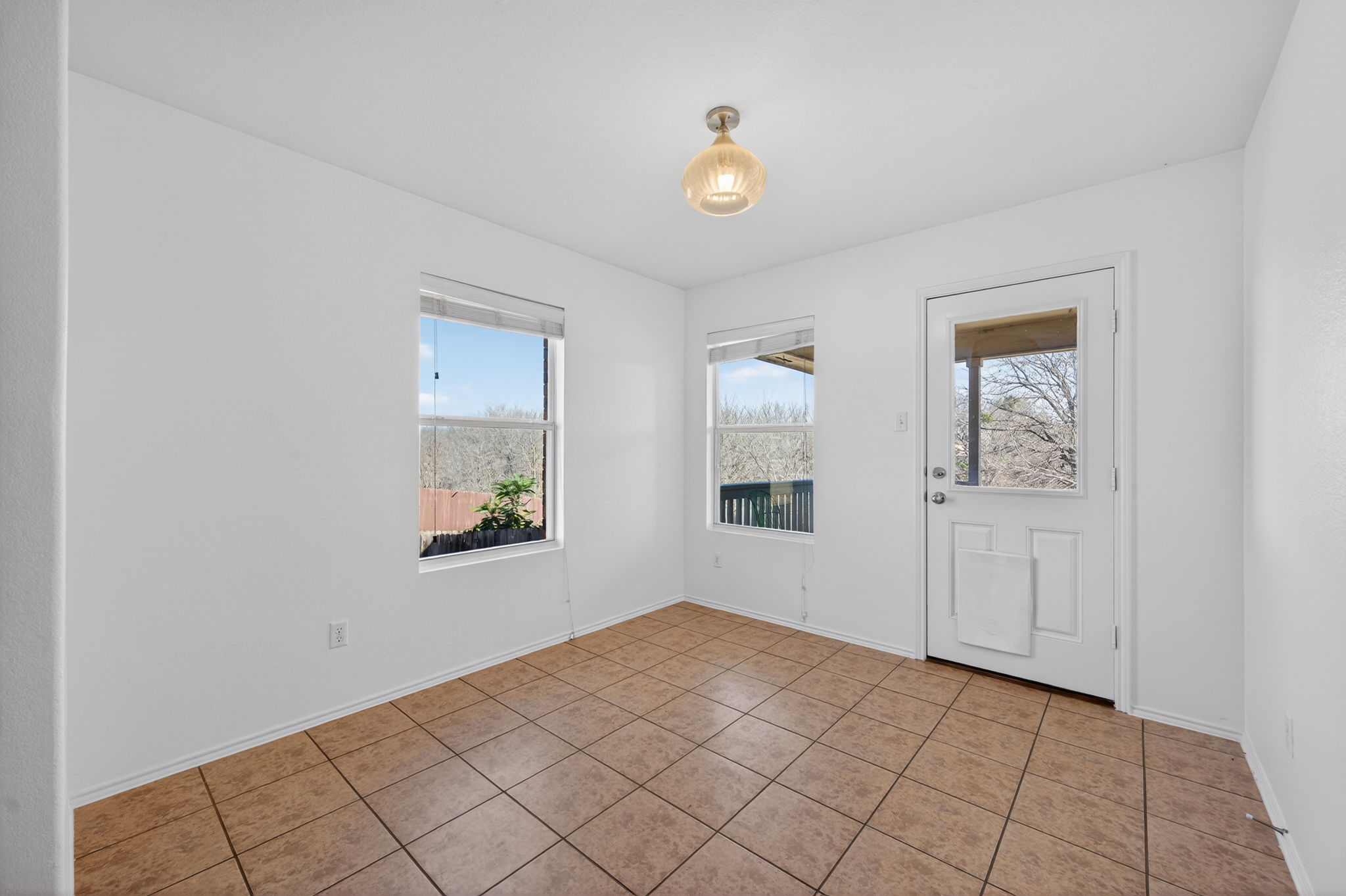 13629 Coomer Path Pflugerville, TX 78660 - Photo 11 of 30 Tiled spare room featuring healthy amount of natural light