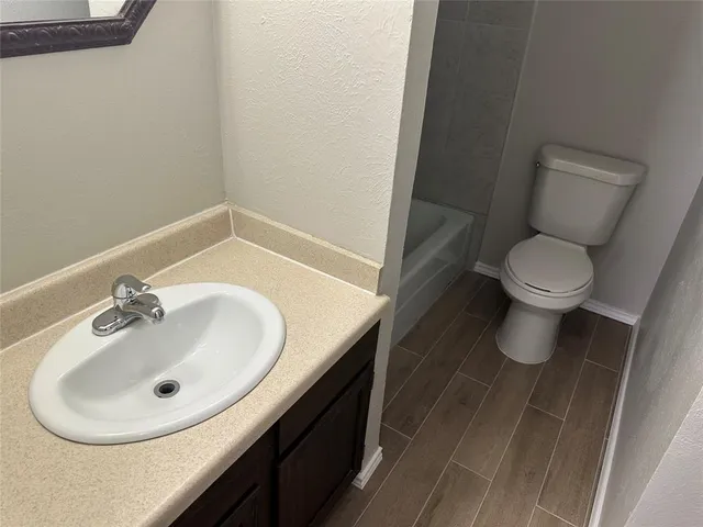 a bathroom with a sink and a toilet