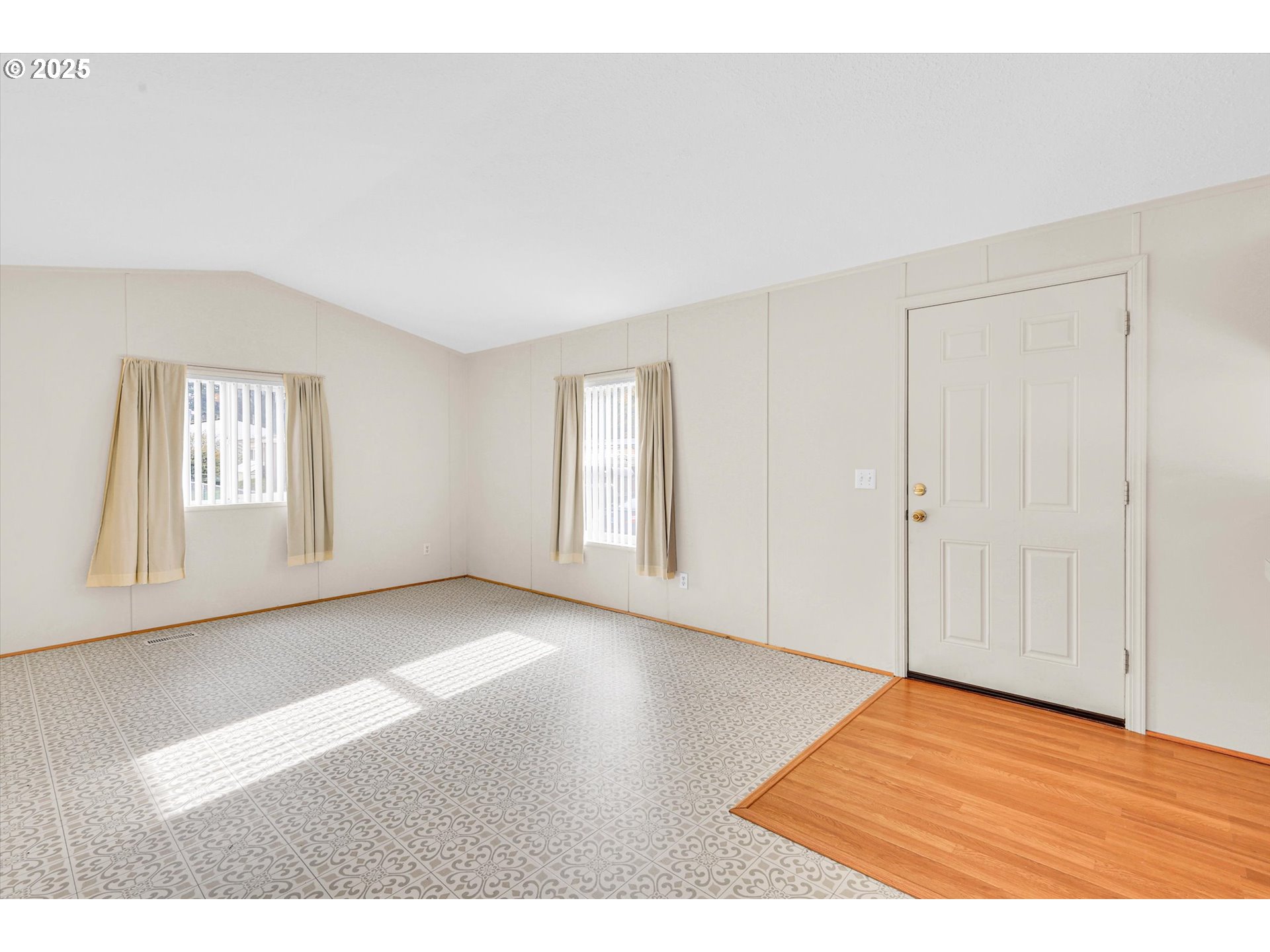 17655 Bluff Road, Unit 73 Sandy, OR 97055 - Photo 11 of 41 a view of an empty room with window and wooden floor