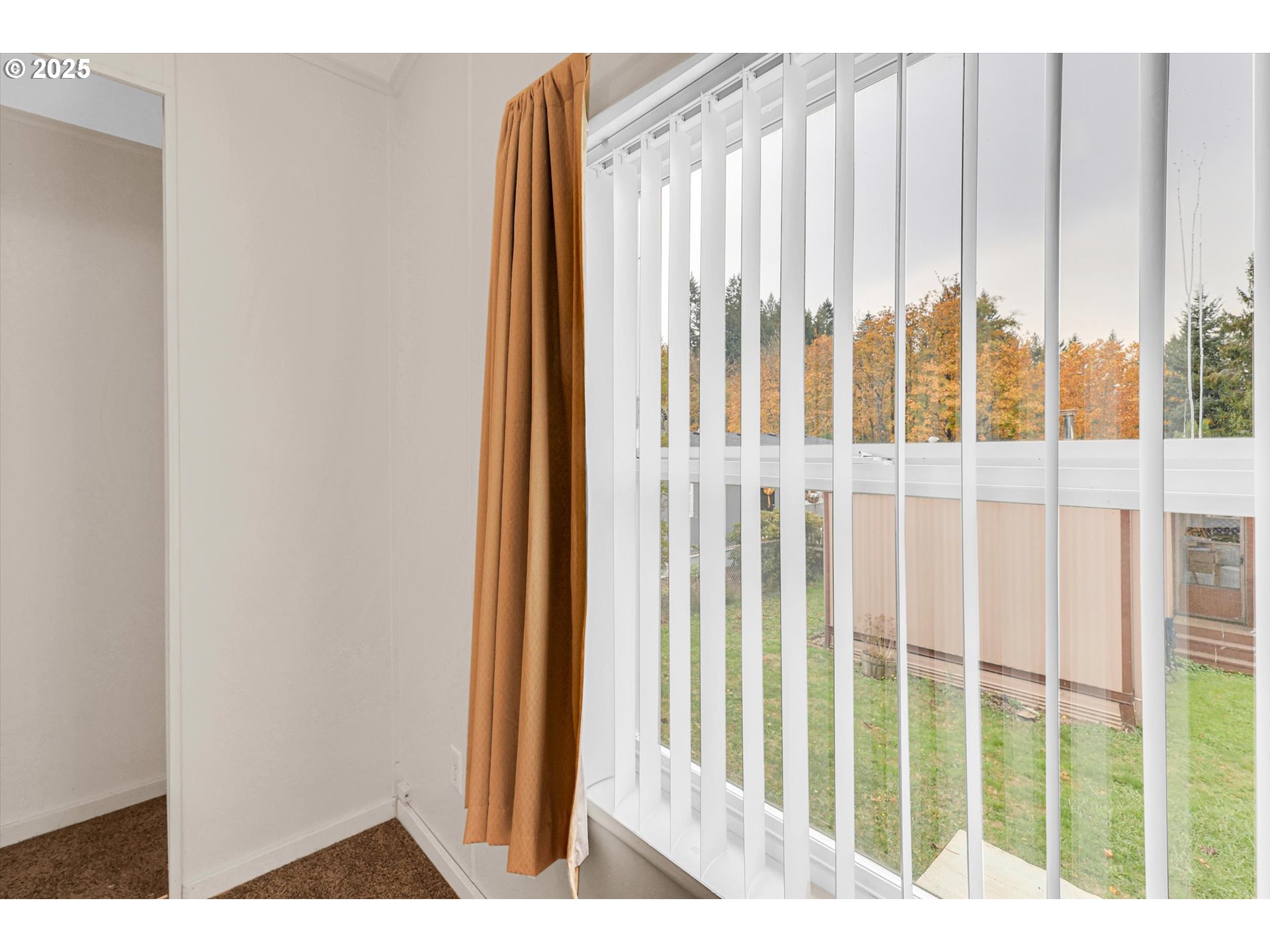 17655 Bluff Road, Unit 73 Sandy, OR 97055 - Photo 22 of 41 a view of a balcony with wooden floor and chair