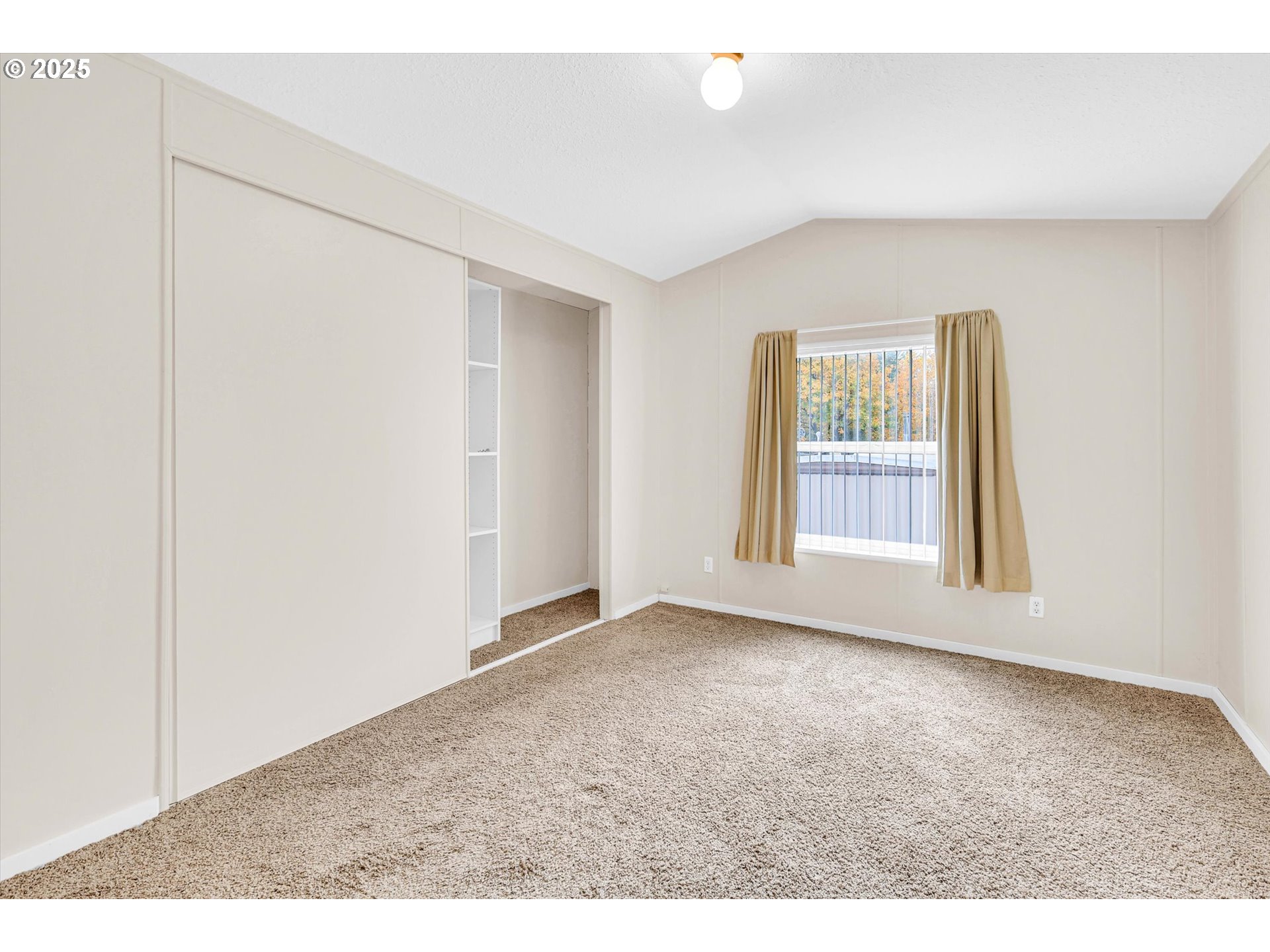 17655 Bluff Road, Unit 73 Sandy, OR 97055 - Photo 23 of 41 an empty room with windows and closet