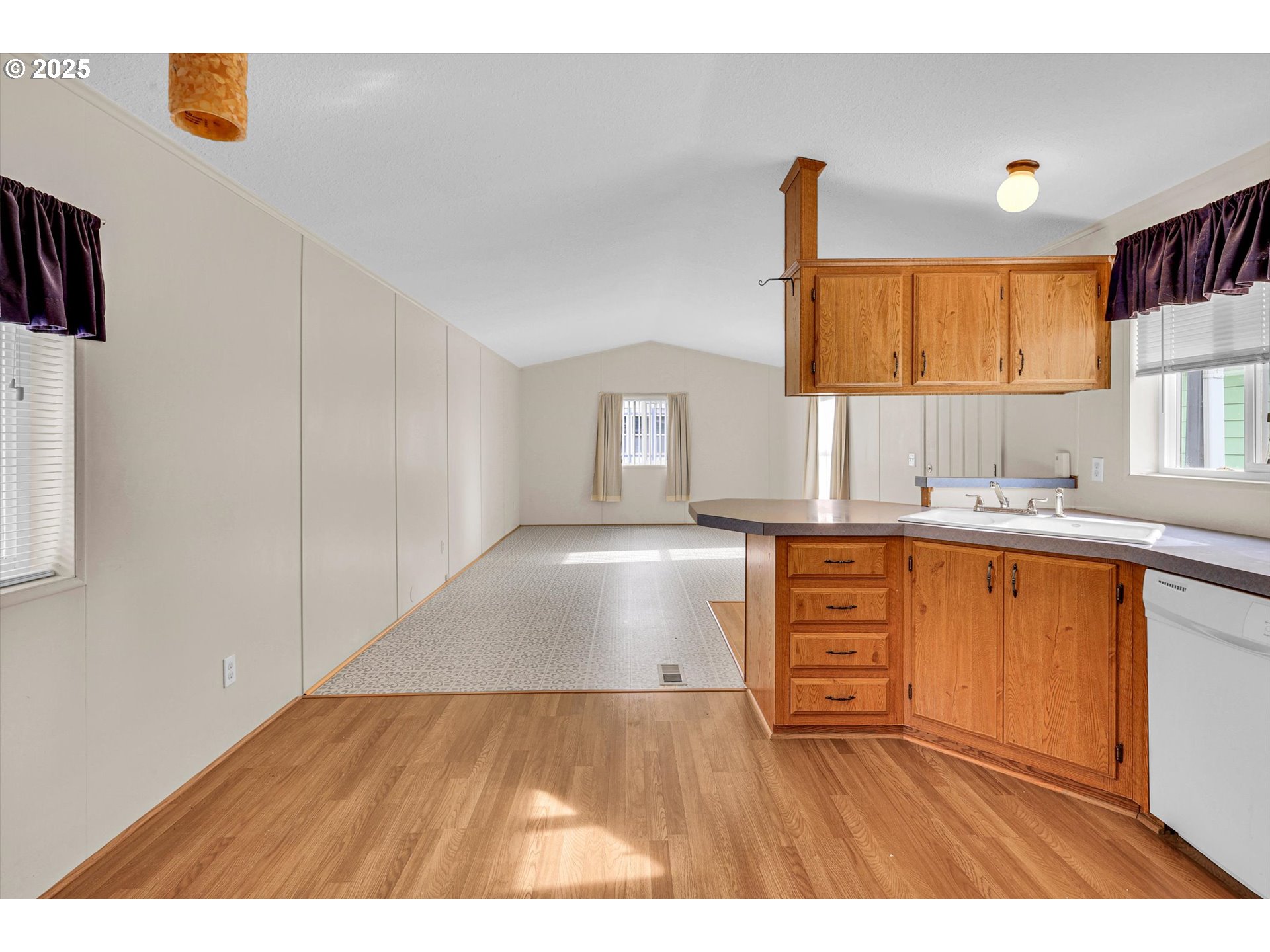 17655 Bluff Road, Unit 73 Sandy, OR 97055 - Photo 9 of 41 a kitchen with granite countertop a refrigerator and a sink