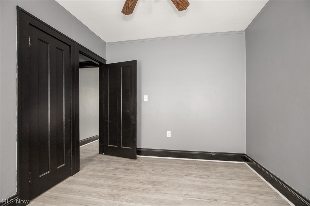1868-1870 Lampson Road Cleveland, OH 44112 - Photo 14 of 36 Interior room featuring light gray walls, wood-finish flooring, and dark trim