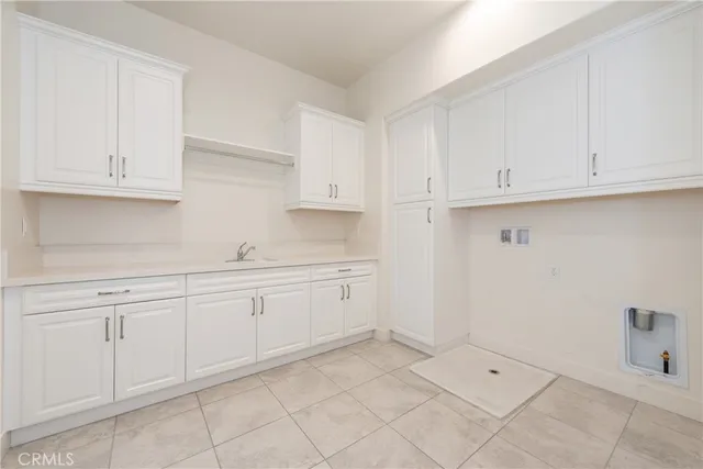 a kitchen with white cabinets