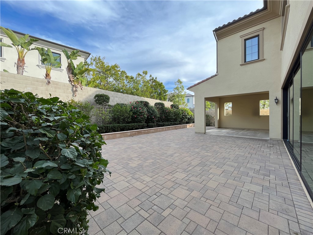 93 Spacial Irvine, CA 92618 - Photo 28 of 29 a view of a house with a yard and potted plants