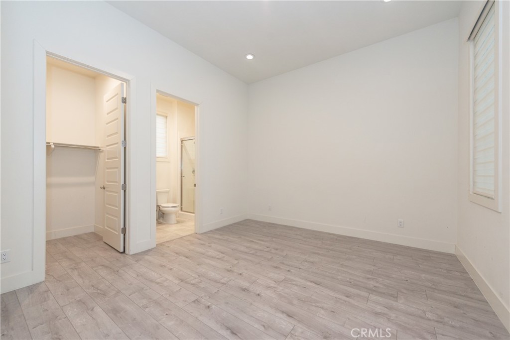 93 Spacial Irvine, CA 92618 - Photo 3 of 29 wooden floor in an empty room