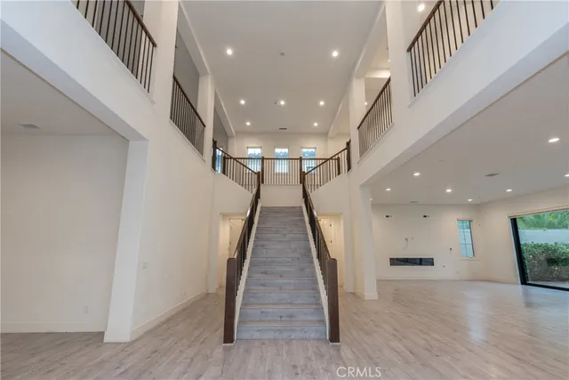 a view of gallery with wooden floor