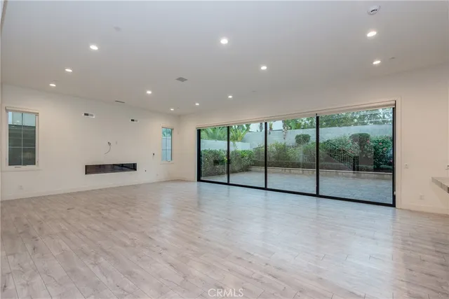 a view of an empty room with a sliding door