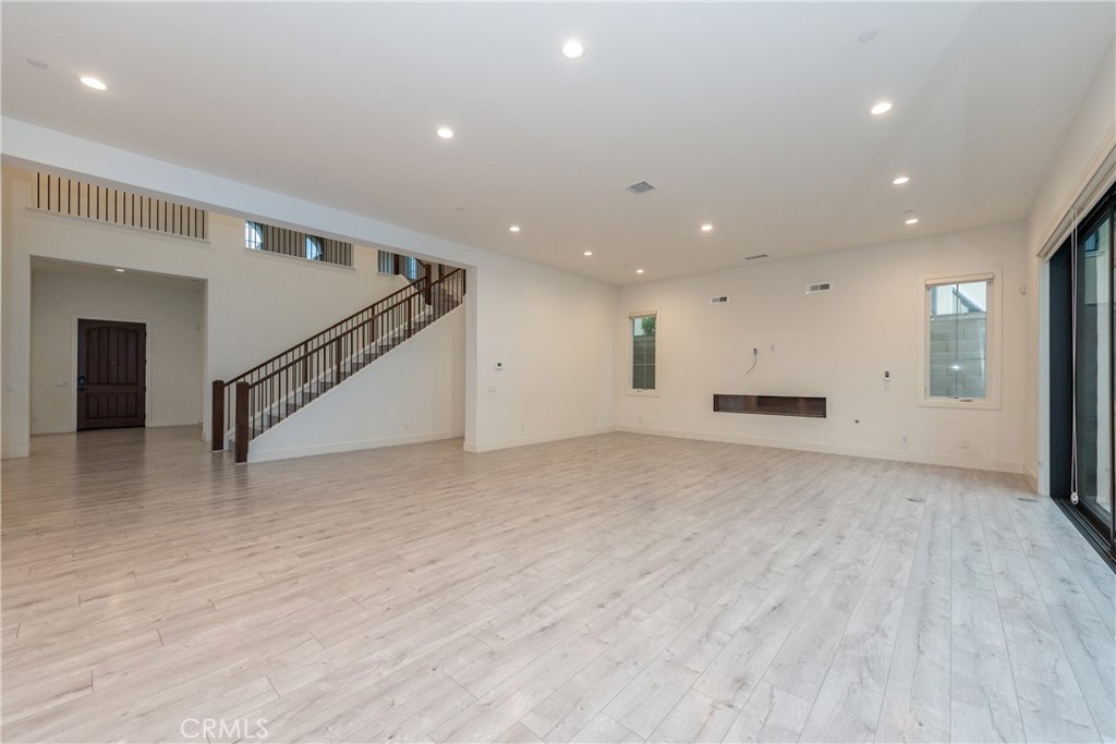 93 Spacial Irvine, CA 92618 - Photo 8 of 29 a view of empty room with wooden floor