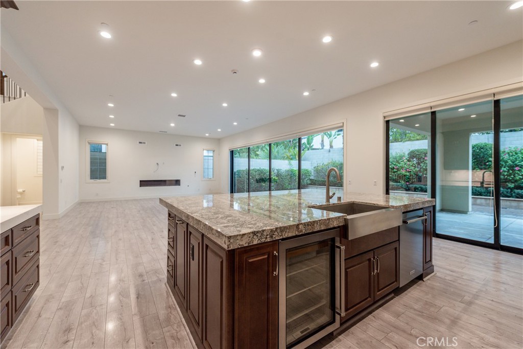 93 Spacial Irvine, CA 92618 - Photo 10 of 29 a kitchen with granite countertop kitchen island a sink and a stove