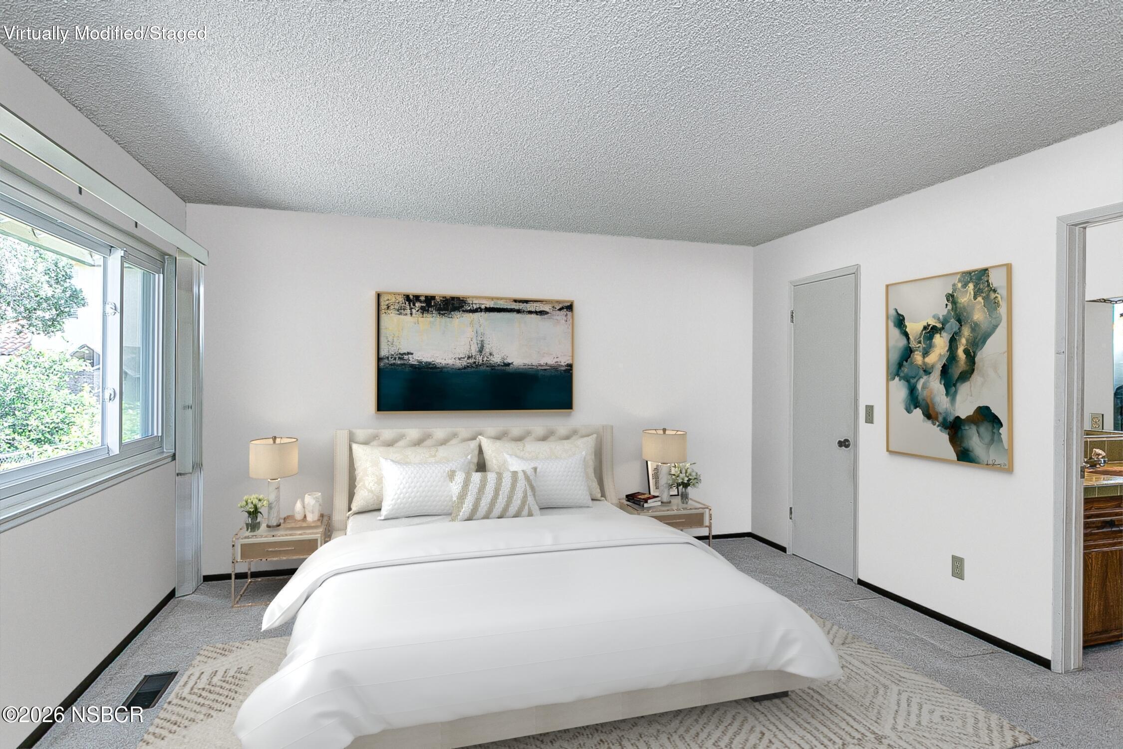 1260 Onstott Road Lompoc, CA 93436 - Photo 22 of 52 a bedroom with a bed and a painting on the wall