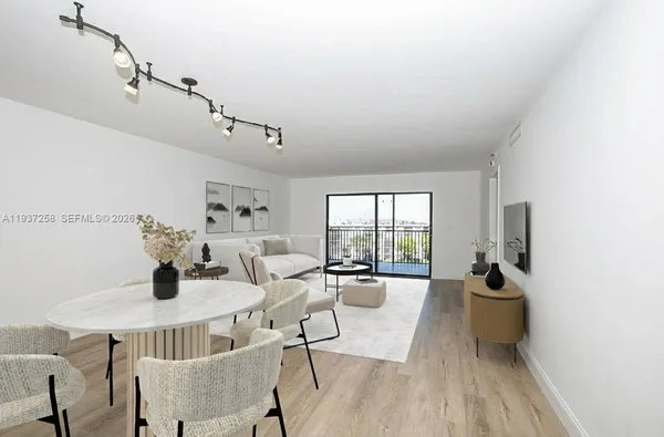 a view of a dining room with furniture window and outside view