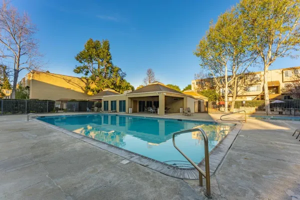 a front view of a house with swimming pool