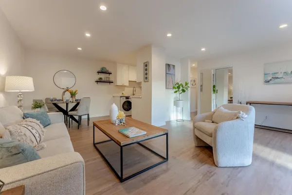 a living room with furniture and a table