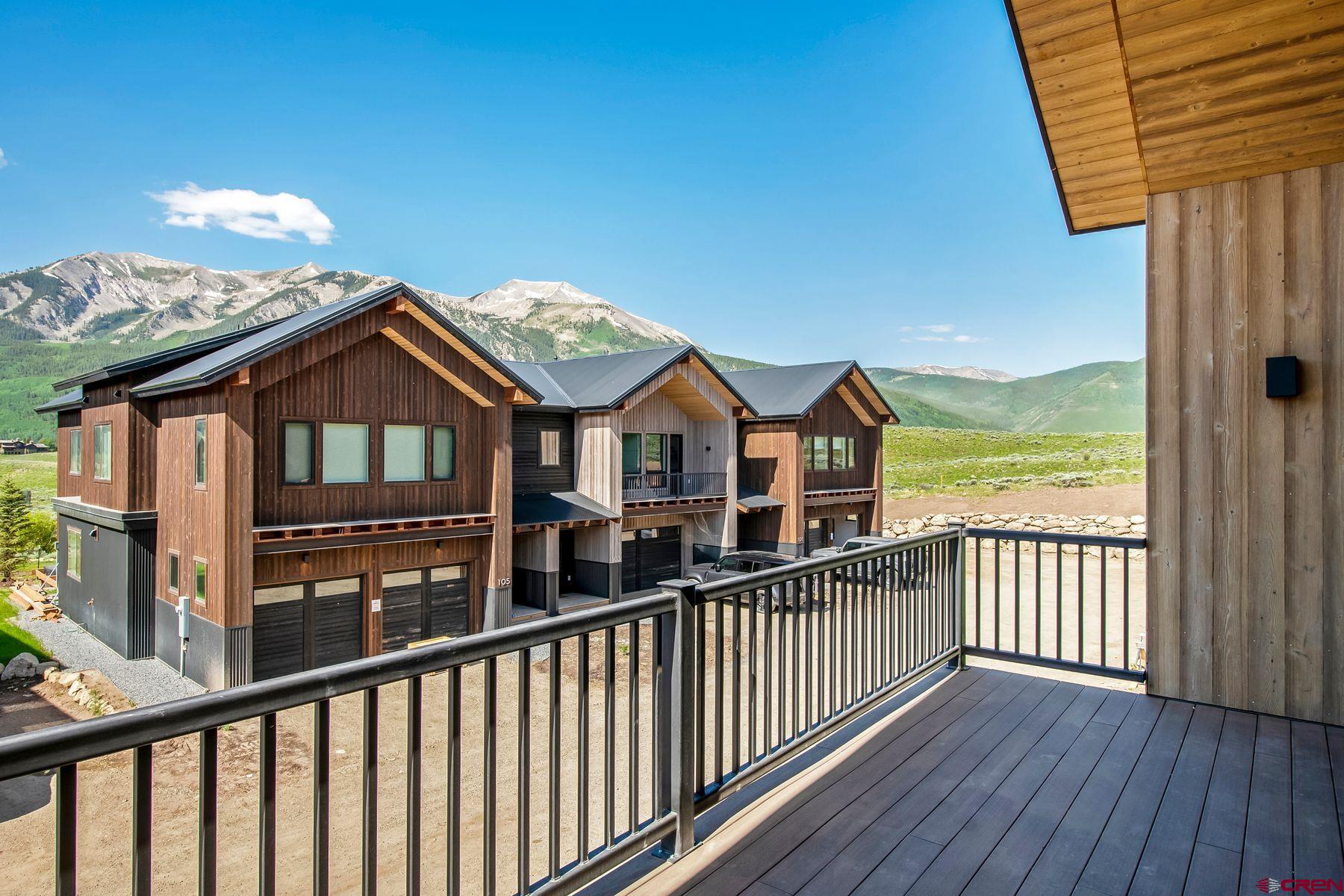 180 Elk Valley Road, Unit 112 Crested Butte, CO 81224 - Photo 4 of 27 a view of a houses with a balcony