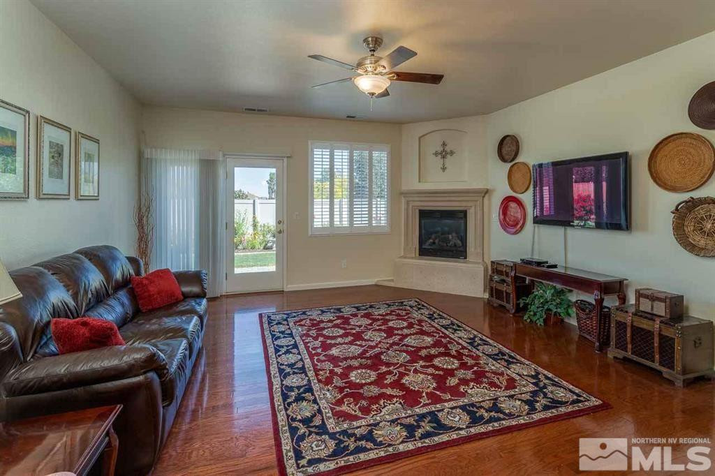 10845 Dancing Aspen Drive Reno, NV 89521 - Photo 4 of 9 a living room with furniture and a fireplace