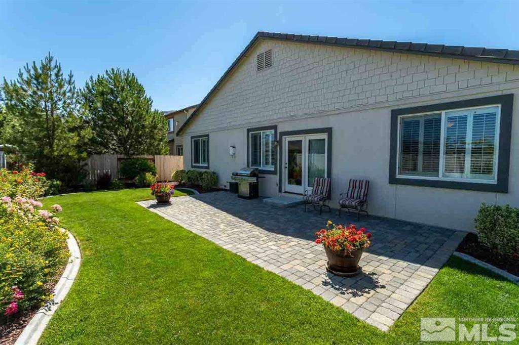 10845 Dancing Aspen Drive Reno, NV 89521 - Photo 9 of 9 a front view of a house with a garden and patio