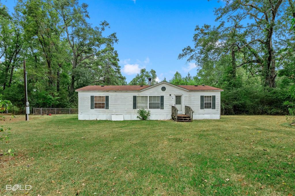 9720 Osburn Road Shreveport, LA 71129 - Photo 28 of 30 Charming manufactured home situated on expansive grounds with mature tree-lined landscaping